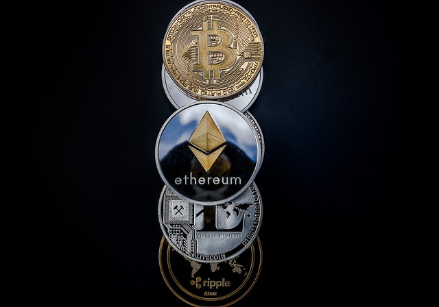 Cryptocurrency coins on reflective surface for a Balanced Crypto Portfolio.