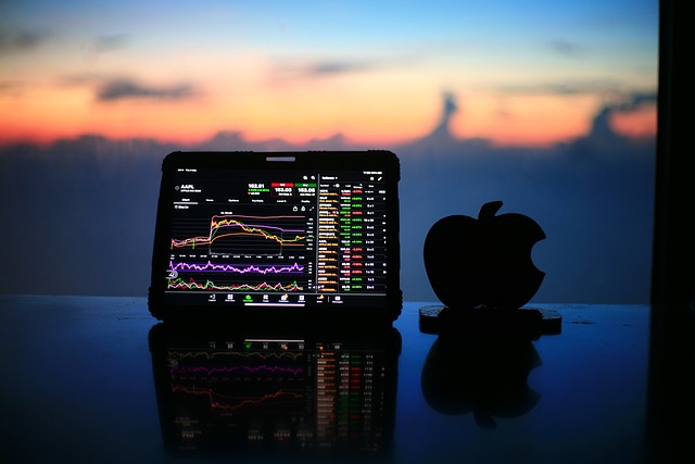 Tablet with stock chart, Apple logo, sunset for a Balanced Crypto Portfolio.